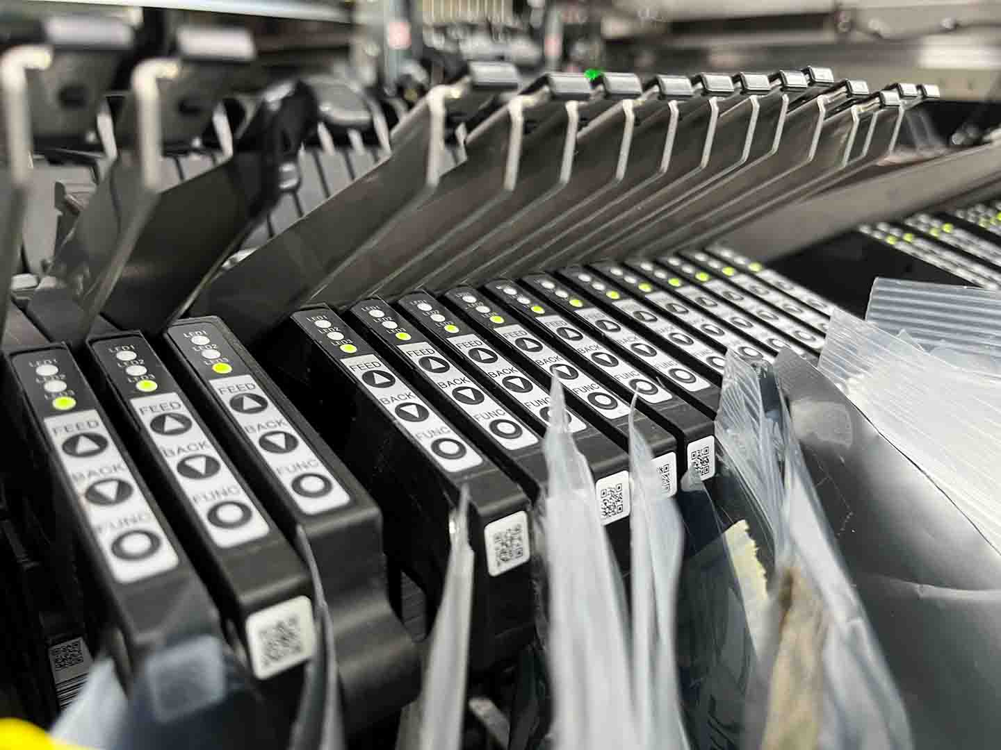 Several case files arranged in a rack at Statron